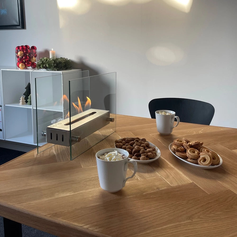 stålbrænder elegant biopejs med hærdet glas på stuebord